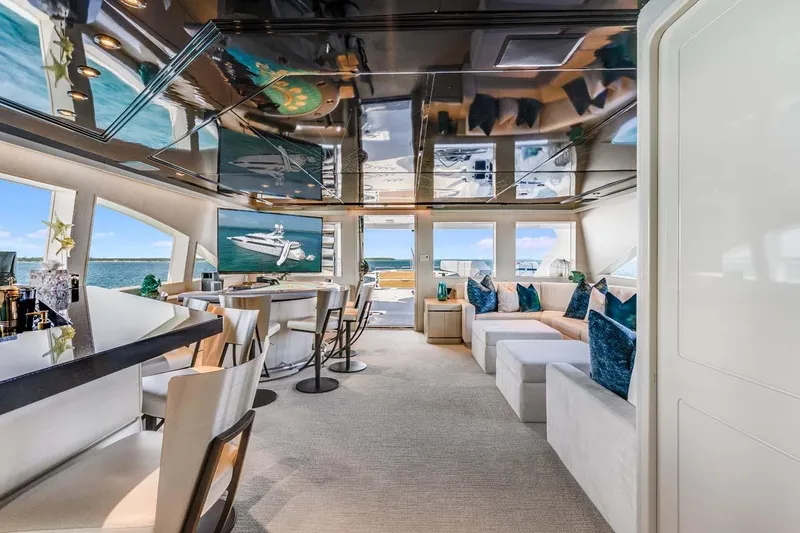 Slide: The Image of Luxurious 2001 Westship Skylounge interior with modern seating, bar, and ocean views. - 43