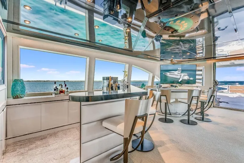 Slide: The Image of Luxurious 2001 Westship Skylounge interior with bar, ocean view, and modern decor. - 44