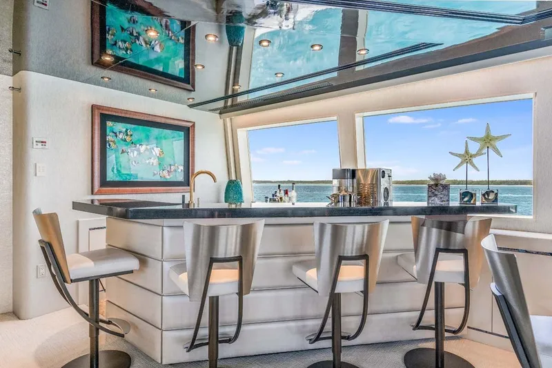 Slide: The Image of Luxurious yacht interior with modern bar, stylish stools, and ocean view; Westship Skylounge 2001. - 45