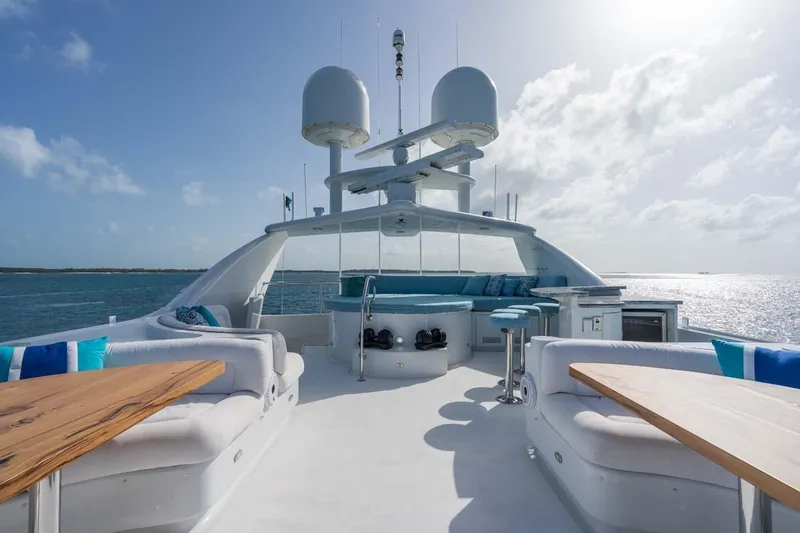 Slide: The Image of Luxurious 2001 Westship Skylounge yacht deck with seating, ocean view, and clear sky. - 49