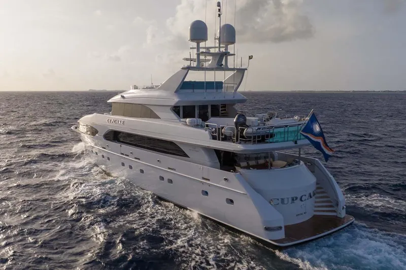 Slide: The Image of Luxury 2001 Westship Skylounge yacht cruising on open sea at sunset. - 57