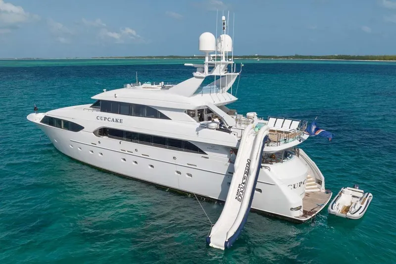 Slide: The Image of Luxury 2001 Westship Skylounge yacht with waterslide, anchored in clear blue ocean. - 58