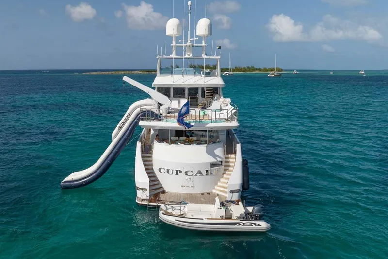 Slide: The Image of Luxury 2001 Westship Skylounge yacht with slide, anchored in clear blue ocean. - 59