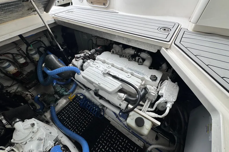 Slide: The Image of Engine compartment of a 2009 Sea Ray 470 Sundancer with visible components and hoses. - 12