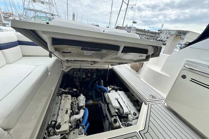 Slide: The Image of 2009 Sea Ray 470 Sundancer engine compartment with open hatch, docked at marina. - 14
