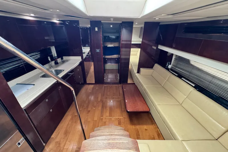 Slide: The Image of Luxurious interior of 2009 Sea Ray 470 Sundancer yacht with modern kitchen and seating area. - 16