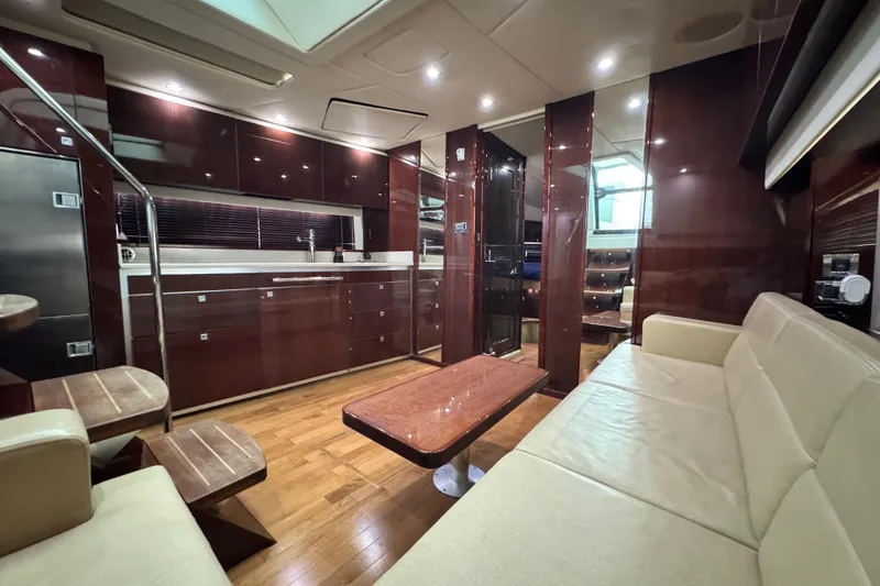 Slide: The Image of Luxurious interior of 2009 Sea Ray 470 Sundancer yacht with modern furnishings and wood finishes. - 19