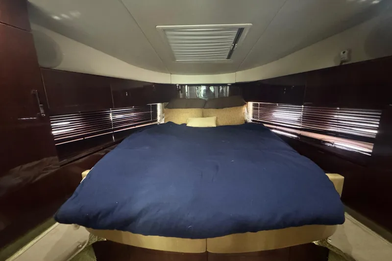 Slide: The Image of Luxurious cabin interior of 2009 Sea Ray 470 Sundancer yacht with cozy bedding. - 21