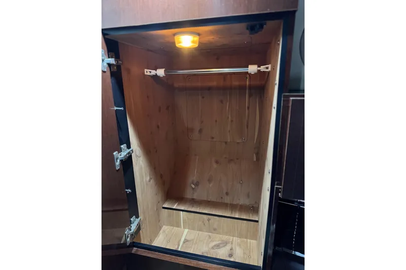 Slide: The Image of Empty wooden closet with light inside Sea Ray 470 Sundancer, 2009 model. - 22