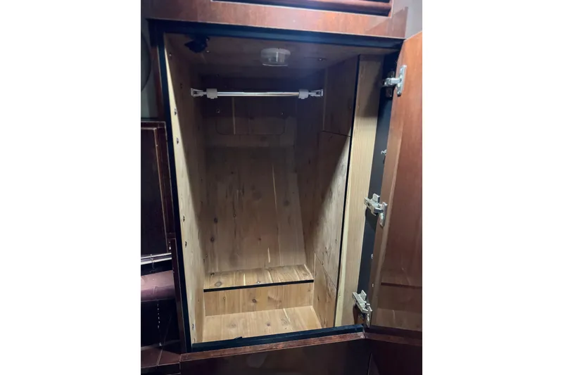 Slide: The Image of Empty wooden closet inside 2009 Sea Ray 470 Sundancer yacht. - 23