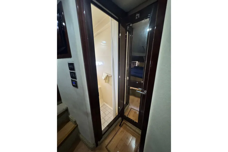 Slide: The Image of Interior view of 2009 Sea Ray 470 Sundancer yacht, showing bathroom and cabin entrance. - 30