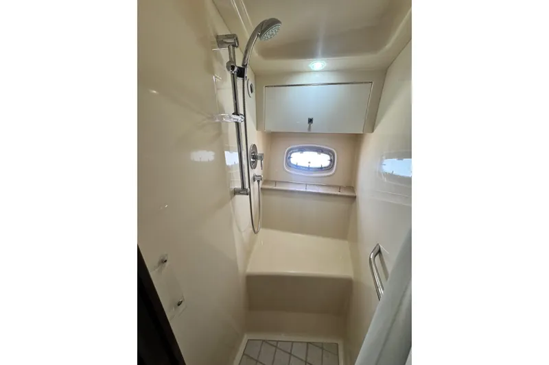 Slide: The Image of Shower area in 2009 Sea Ray 470 Sundancer yacht, featuring modern fixtures and a small window. - 31