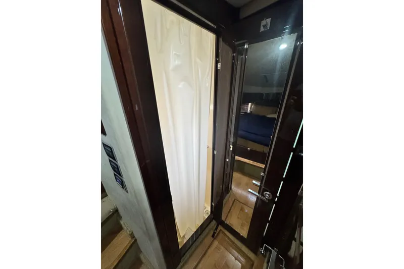Slide: The Image of Interior view of 2009 Sea Ray 470 Sundancer yacht, featuring a cabin entrance and shower area. - 32