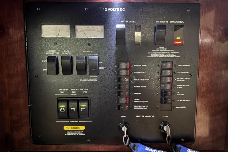 Slide: The Image of Control panel of a 2009 Sea Ray 470 Sundancer boat, featuring switches and gauges. - 37