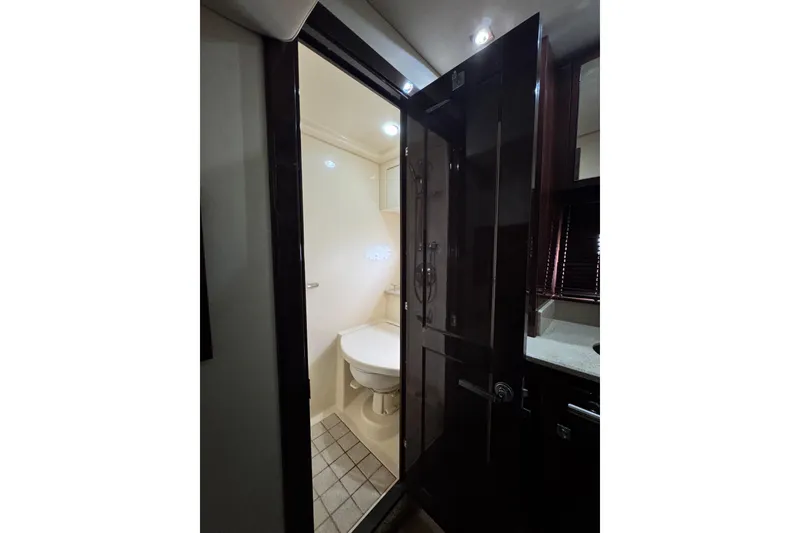 Slide: The Image of Bathroom interior of 2009 Sea Ray 470 Sundancer yacht, featuring modern fixtures and lighting. - 45