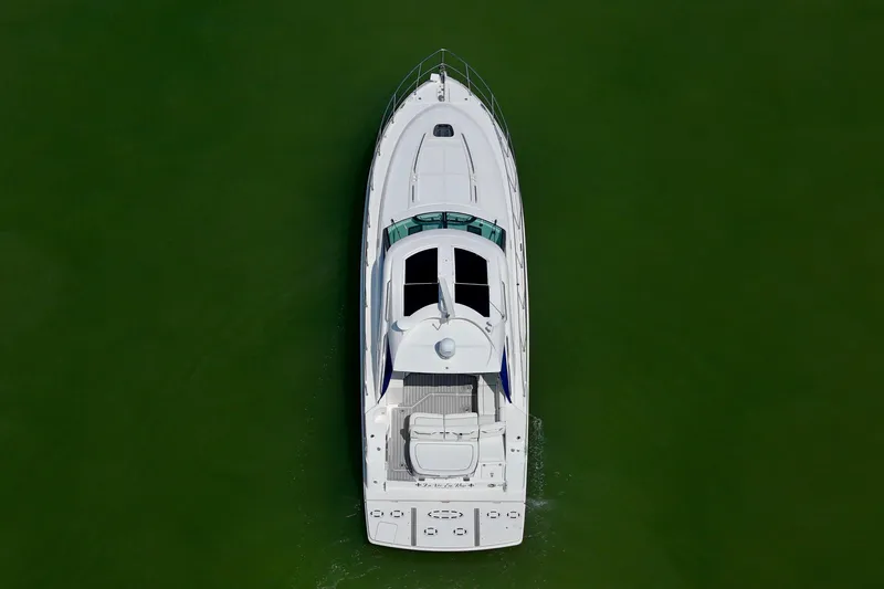 Slide: The Image of Aerial view of 2009 Sea Ray 470 Sundancer yacht on green water. - 5