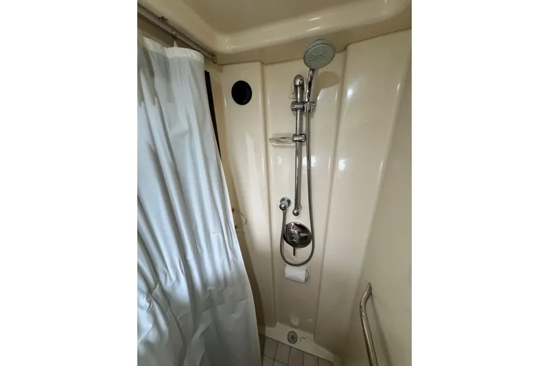 Slide: The Image of Shower area in 2009 Sea Ray 470 Sundancer yacht with curtain and chrome fixtures. - 50