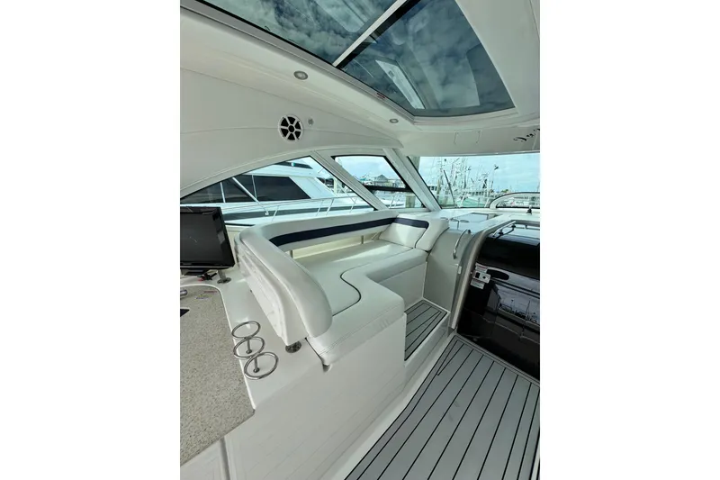 Slide: The Image of Interior of 2009 Sea Ray 470 Sundancer yacht with sleek seating and modern design. - 56