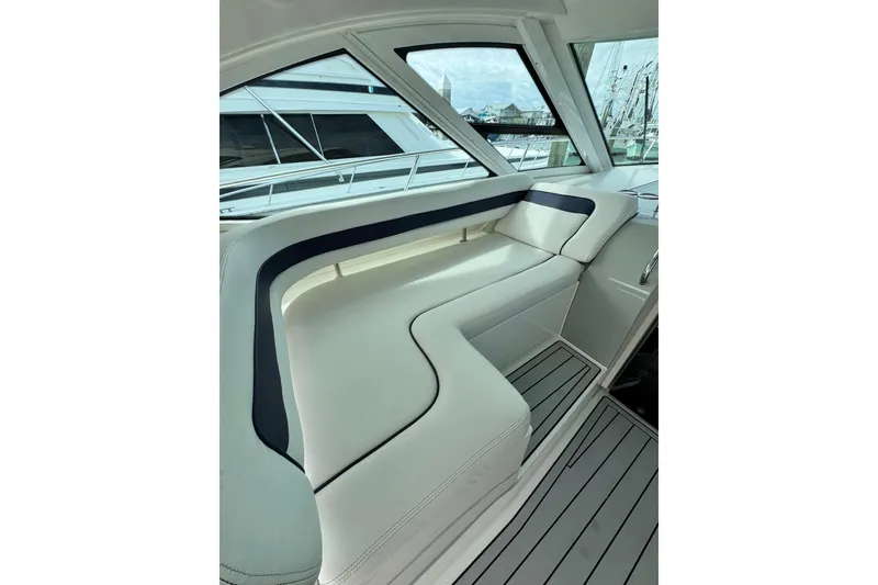 Slide: The Image of Luxurious interior seating of 2009 Sea Ray 470 Sundancer yacht, featuring sleek design and comfort. - 57