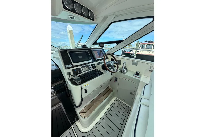 Slide: The Image of Interior helm of 2009 Sea Ray 470 Sundancer yacht with modern navigation equipment. - 58