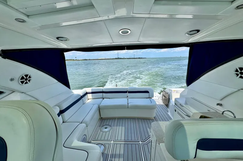 Slide: The Image of Luxurious 2009 Sea Ray 470 Sundancer yacht interior with ocean view and elegant seating. - 6