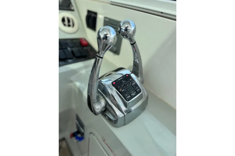 Slide: The Image of Throttle controls on a 2009 Sea Ray 470 Sundancer yacht dashboard. - 63