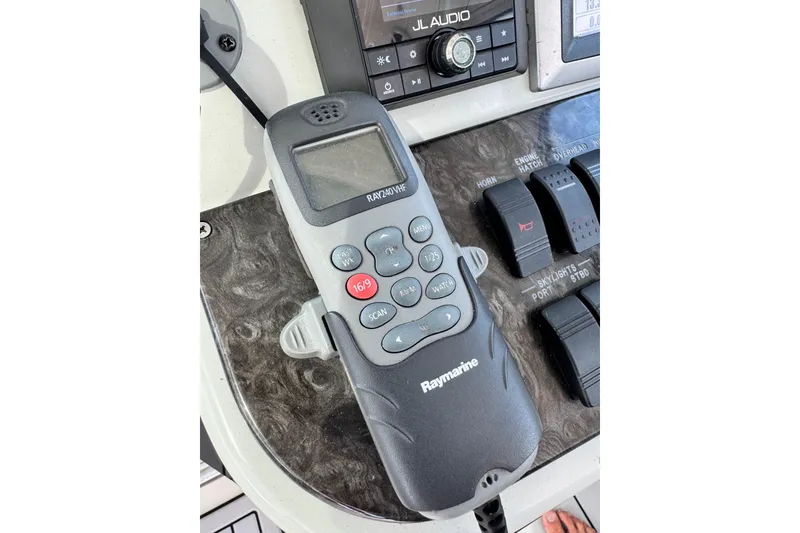 Slide: The Image of Raymarine VHF radio on 2009 Sea Ray 470 Sundancer yacht dashboard. - 70
