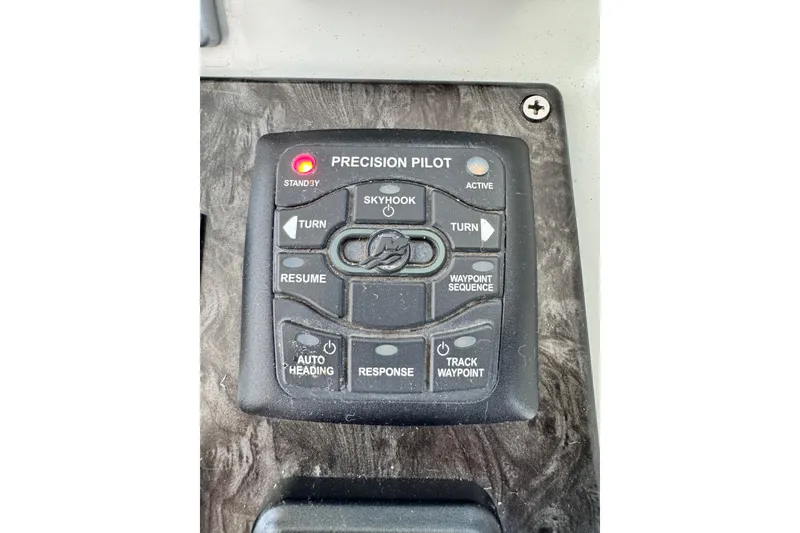 Slide: The Image of Control panel of a 2009 Sea Ray 470 Sundancer boat, featuring Precision Pilot system. - 72