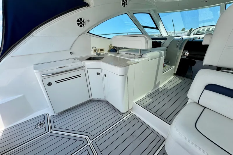 Slide: The Image of Luxurious interior of 2009 Sea Ray 470 Sundancer yacht with sleek white cabinetry. - 8