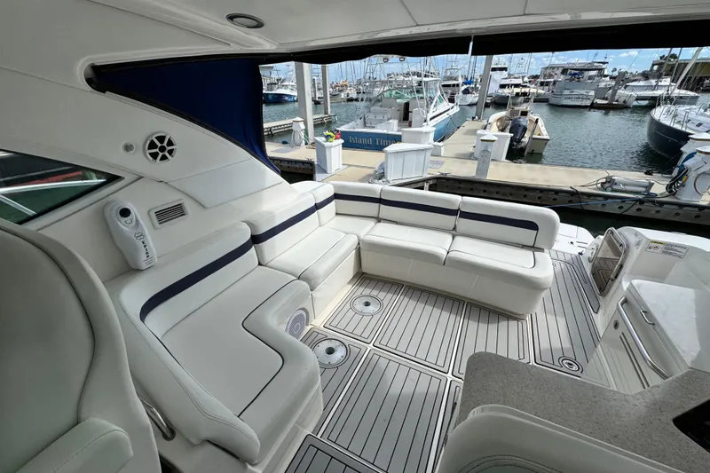 Slide: The Image of Luxurious 2009 Sea Ray 470 Sundancer yacht interior with white seating at marina. - 85