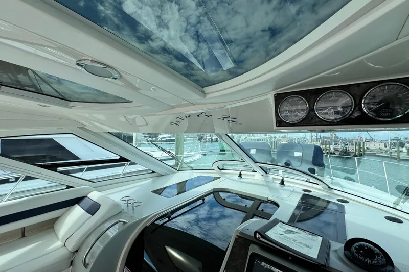 Slide: The Image of Interior view of 2009 Sea Ray 470 Sundancer yacht with panoramic windows and control panel. - 89