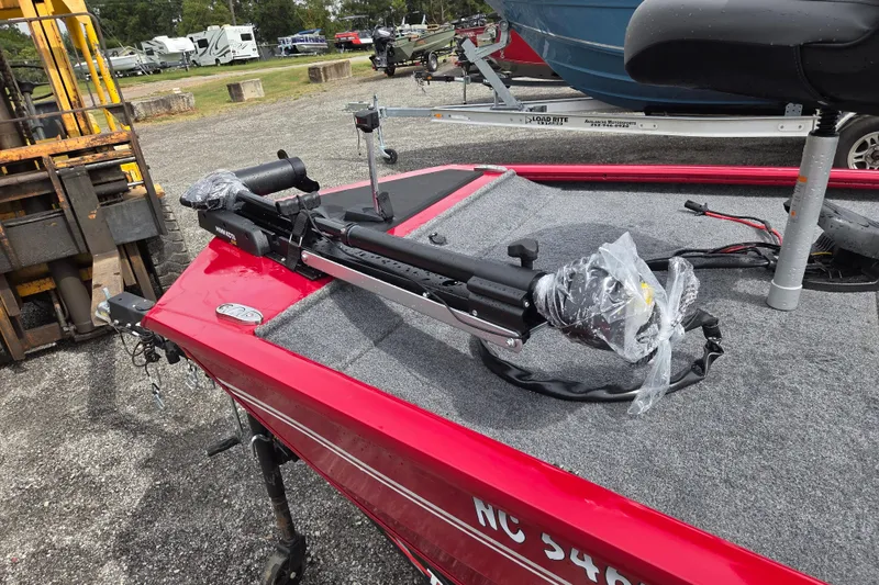 Slide: The Image of 2023 Tracker Pro 170 boat with trolling motor, parked outdoors. - 13