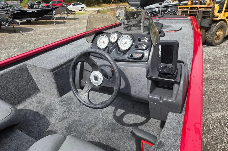 Slide: The Image of 2023 Tracker Pro 170 boat interior with steering wheel and control panel. - 9