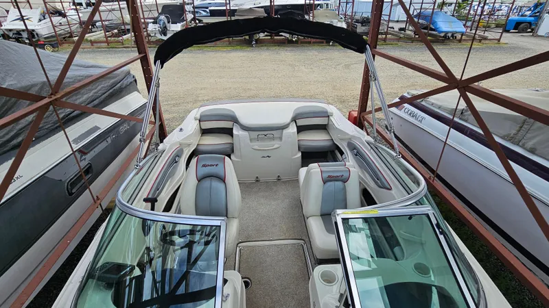 Slide: The Image of 2008 Sea Ray 205 Sport boat interior with seating and windshield. - 12