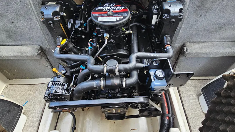 Slide: The Image of 2008 Sea Ray 205 Sport boat engine compartment with 5.0L MerCruiser engine. - 22