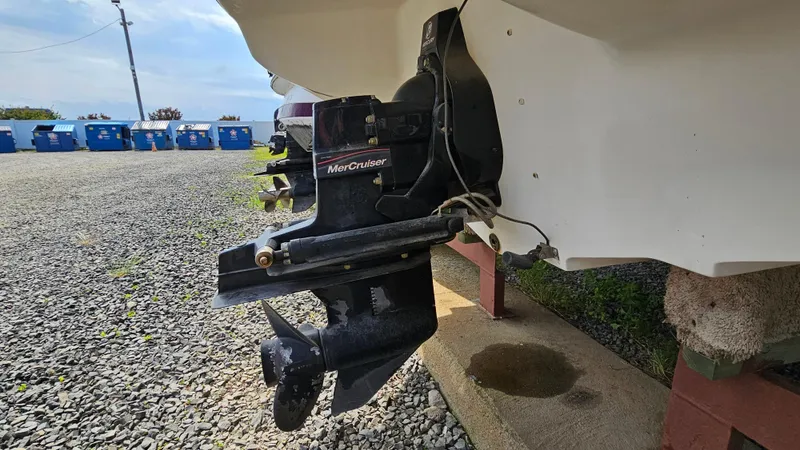 Slide: The Image of 2008 Sea Ray 205 Sport boat with MerCruiser outdrive in a gravel lot. - 26