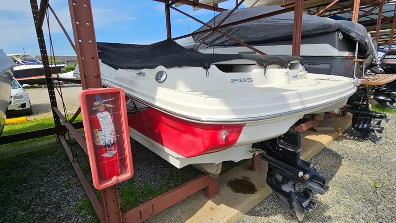 Slide: The Image of 2008 Sea Ray 205 Sport boat in storage, rear view. - 5