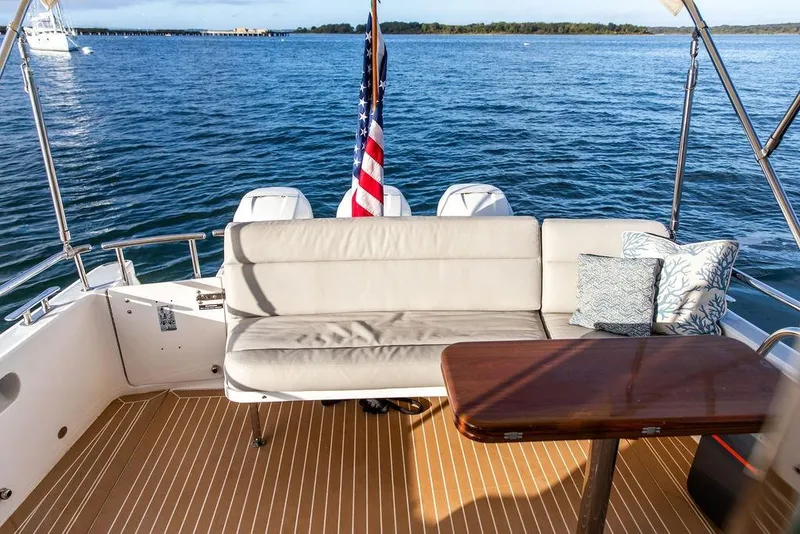 Slide: The Image of Luxury seating area on 2018 MJM 43z yacht with ocean view and American flag. - 15