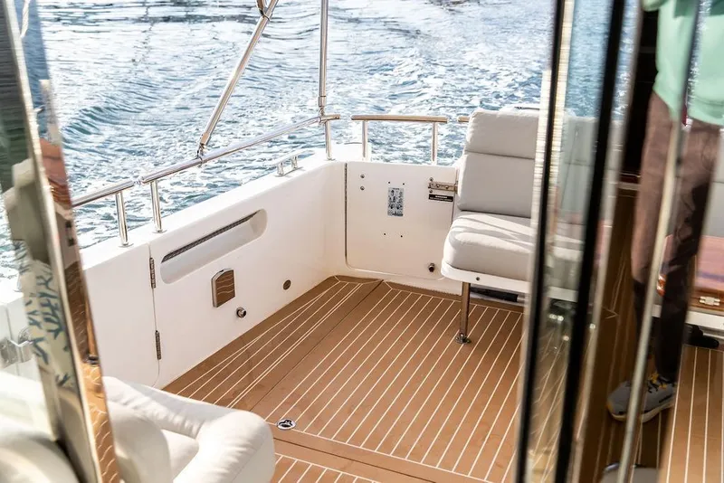 Slide: The Image of Luxurious 2018 MJM 43z yacht interior with comfortable seating and elegant wood flooring. - 17