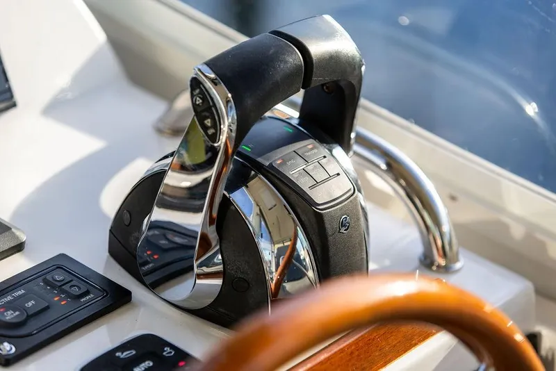 Slide: The Image of Throttle controls on a 2018 MJM 43z yacht, featuring sleek design and modern technology. - 22