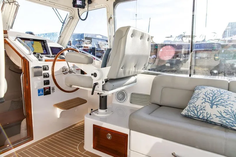 Slide: The Image of Interior of 2018 MJM 43z boat with helm, seating, and navigation equipment. - 27