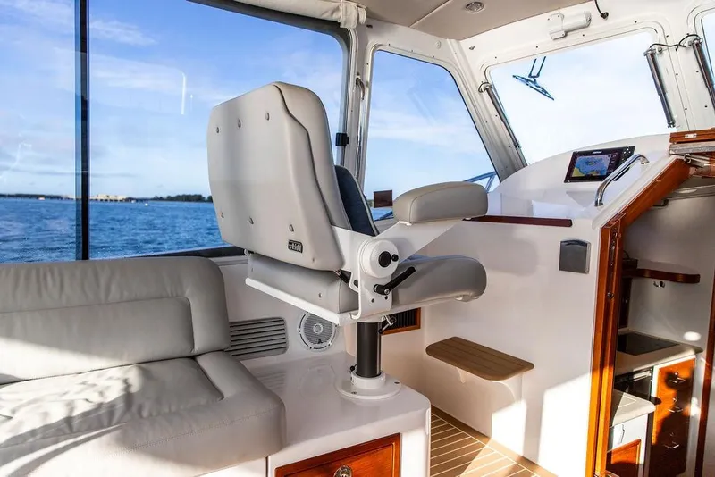 Slide: The Image of Interior of 2018 MJM 43z boat with helm seat and navigation equipment. - 28