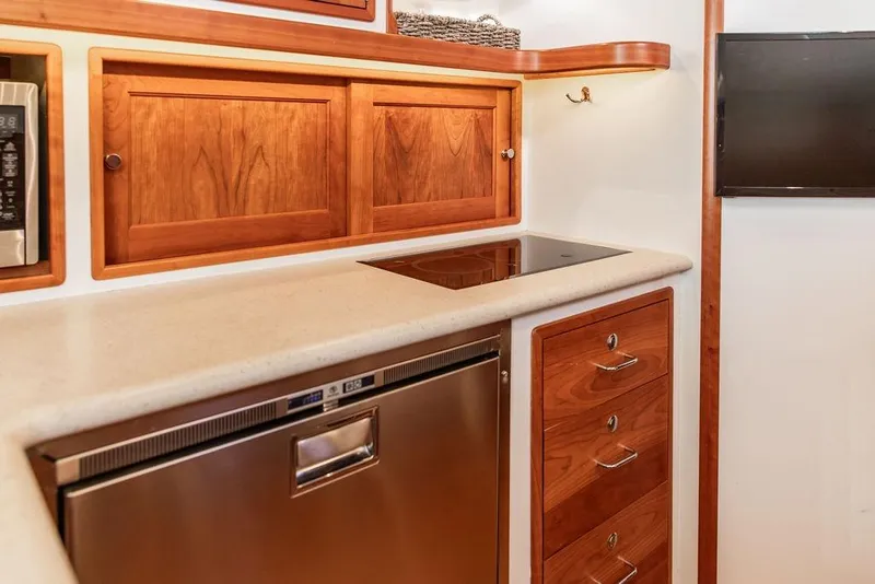 Slide: The Image of Luxurious 2018 MJM 43z yacht kitchen with wooden cabinets and modern appliances. - 33