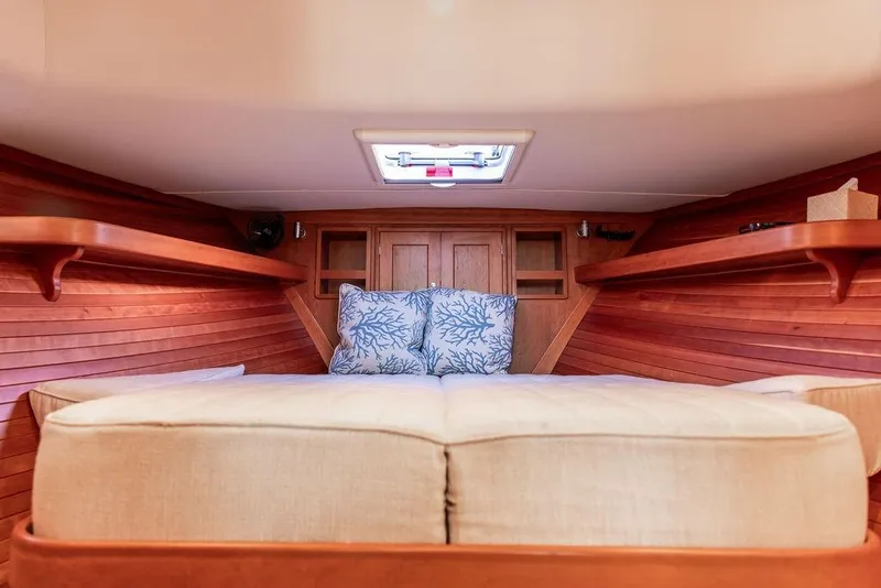 Slide: The Image of Luxurious cabin interior of 2018 MJM 43z yacht with cozy bedding and wooden accents. - 40