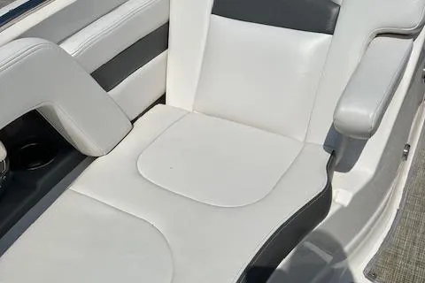 Slide: The Image of 2016 Chaparral 264 Sunesta boat seat with white and gray upholstery. - 17