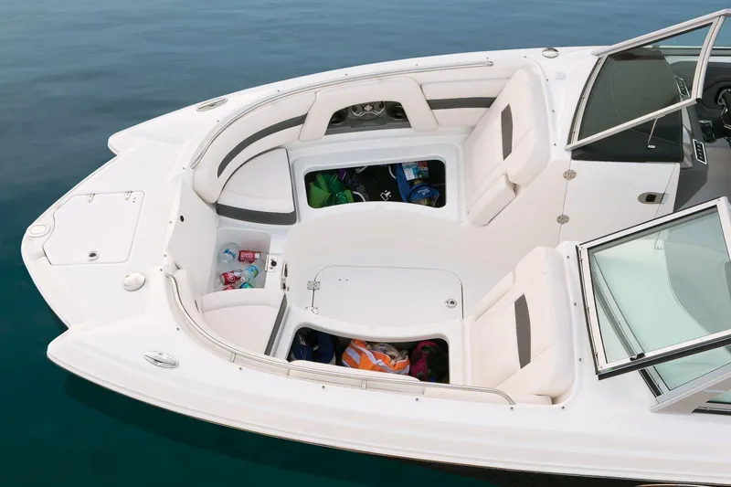 Slide: The Image of Manufacturer Provided Image: 2016 Chaparral 264 Sunesta boat with open storage compartments and seating. - 2