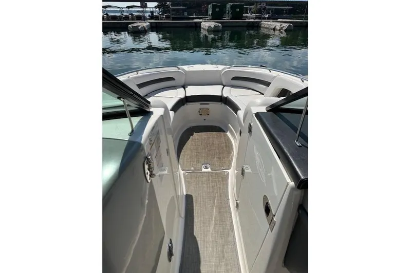 Slide: The Image of 2016 Chaparral 264 Sunesta boat interior with seating and open deck view. - 20