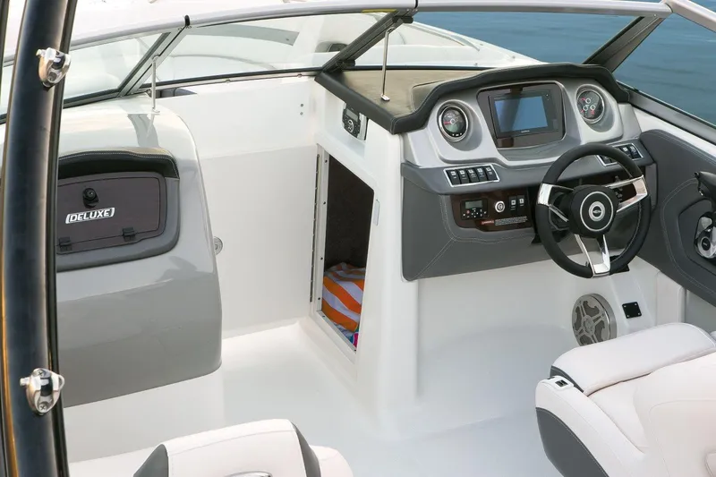 Slide: The Image of Manufacturer Provided Image: 2016 Chaparral 264 Sunesta boat cockpit with steering wheel and dashboard. - 4