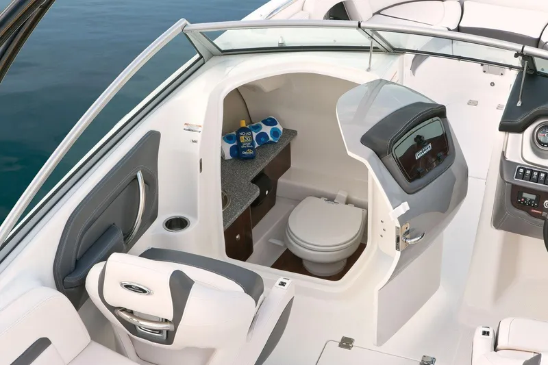 Slide: The Image of Manufacturer Provided Image: 2016 Chaparral 264 Sunesta boat interior with toilet and seating area. - 5
