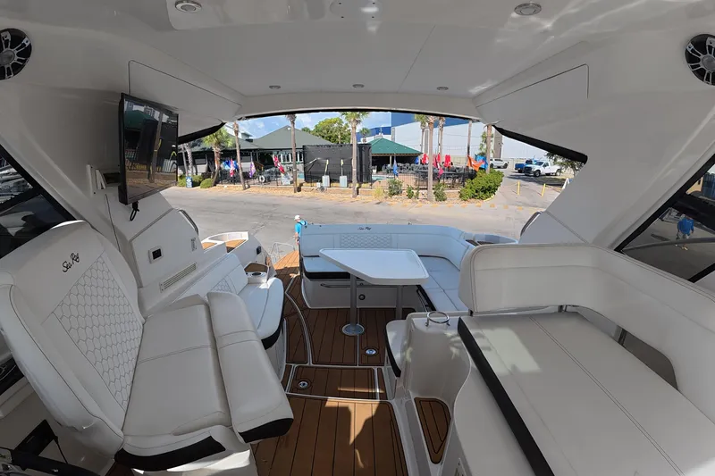 Slide: The Image of 2021 Sea Ray Sundancer 350 Coupe interior with luxurious seating and modern amenities. - 7